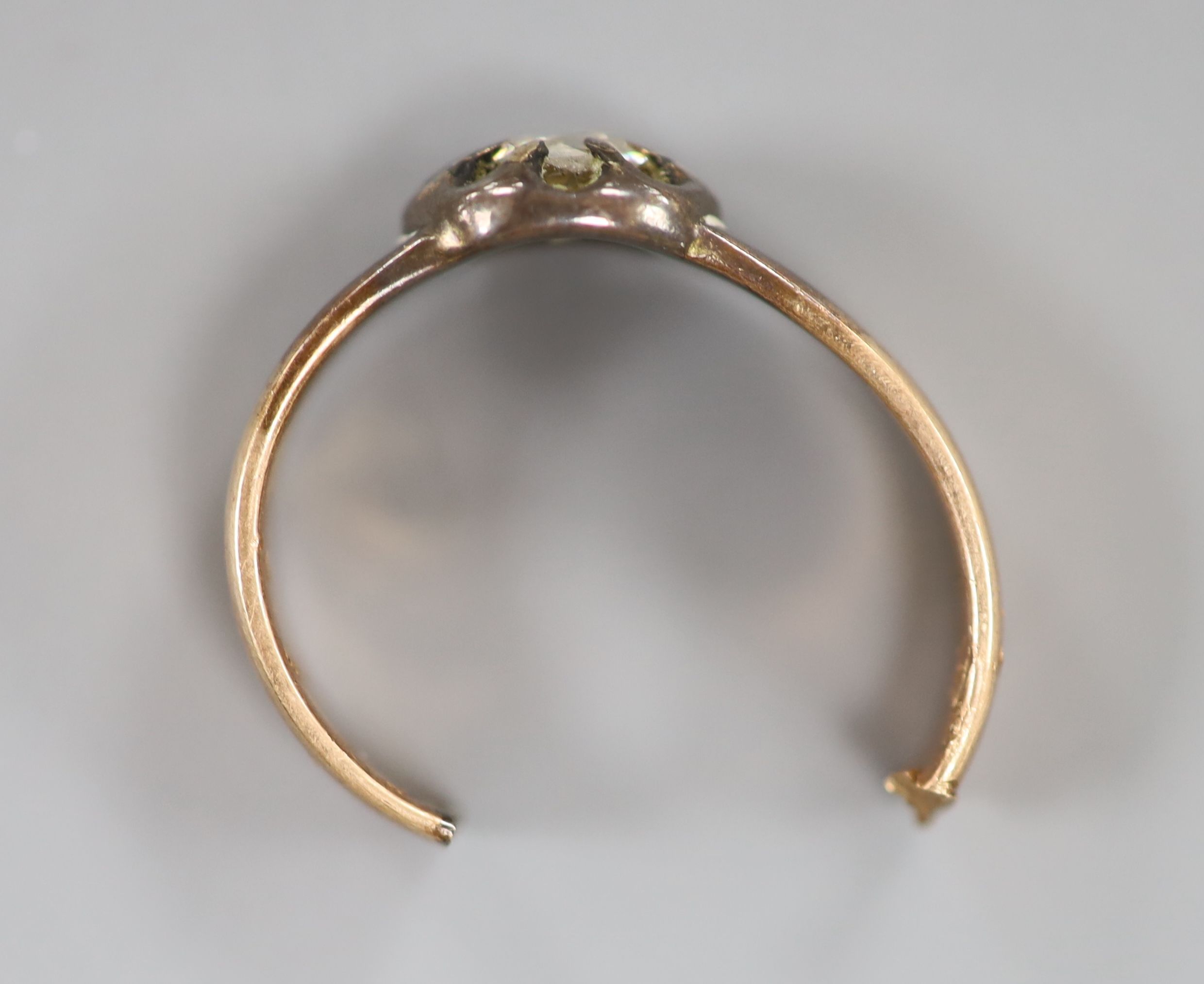 A diamond solitaire and gold ring (tests as 14ct), cut, gross 6.1 grams.